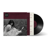Vinyl record with cover featuring a black and white photo of a person in nature.