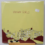 Front cover of Vivian Girls self-titled vinyl with building artwork and band name