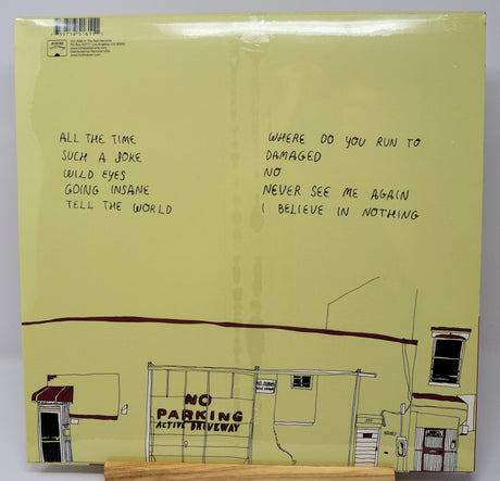 Back cover of Vivian Girls vinyl showing handwritten tracklist and yellow building illustration
