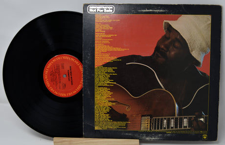 Back cover of Wah Wah Watson's 'Elementary' vinyl LP showing tracklist and artist photo
