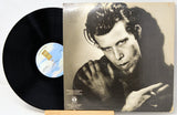 Vinyl record with cover featuring a black and white portrait of a person.