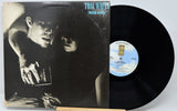 Vinyl record with cover featuring a black and white image of a man and woman, with a visible label.
