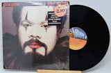 Vinyl record with cover featuring a portrait and 'Chic-Agogo' label.