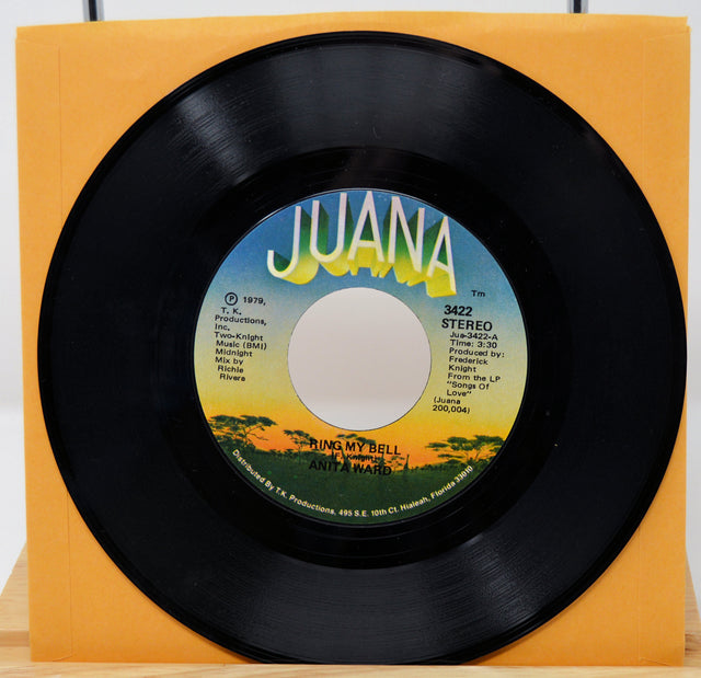 Vinyl record with 'Juana' label on a yellow background