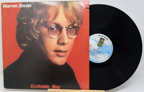 Vinyl record with cover featuring a person's portrait and album title 'Excitable Boy' by Warren Zevon.