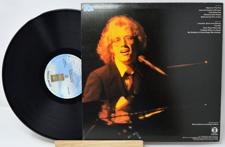 Vinyl record with a cover featuring a person holding a microphone.