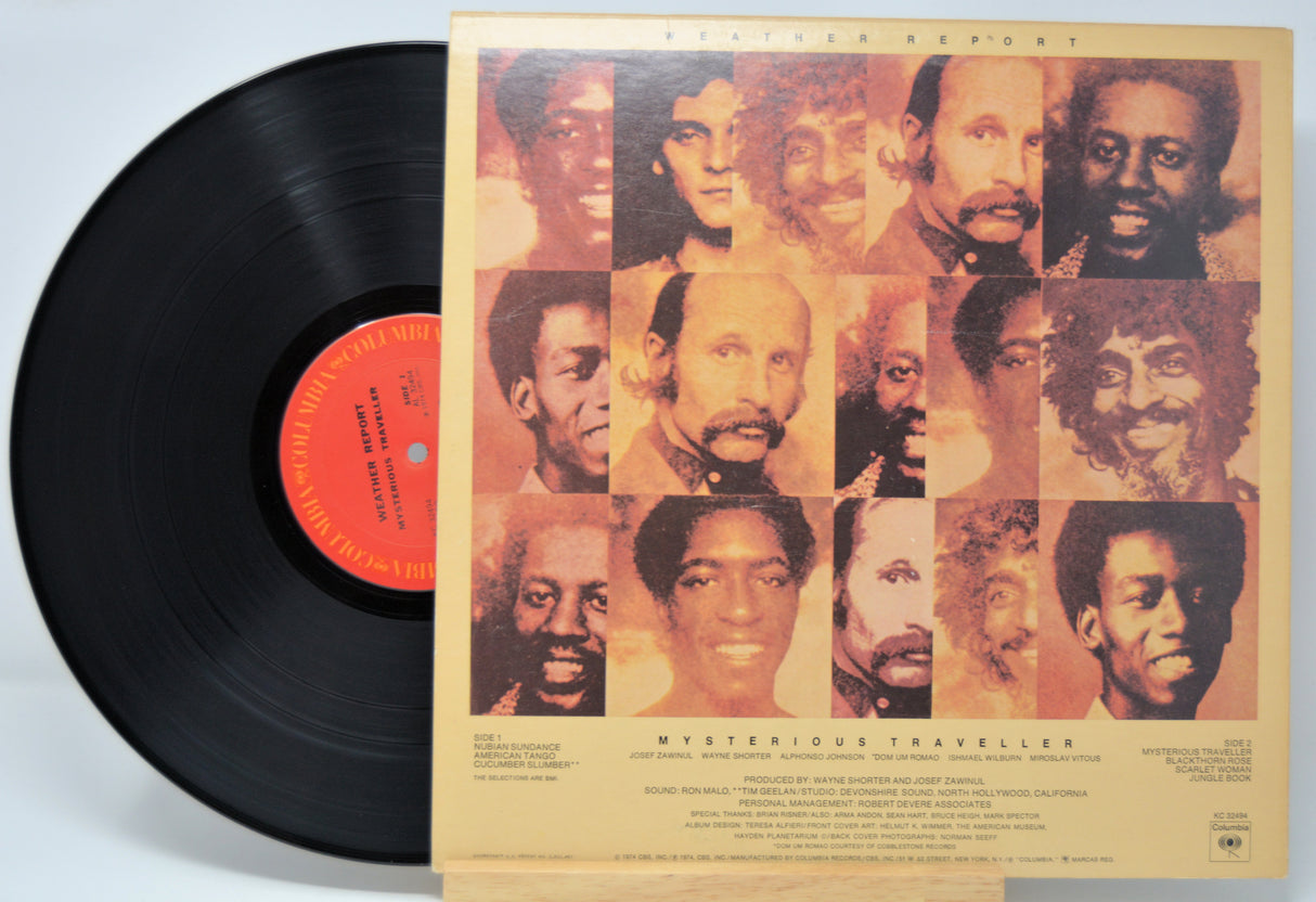 'Weather Report Mysterious Traveller' Vinyl record with a colorful album cover featuring multiple portraits.