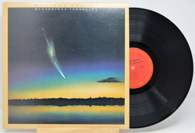 'Weather Report Mysterious Traveller' Vinyl record with a cover featuring a comet over a lake at night