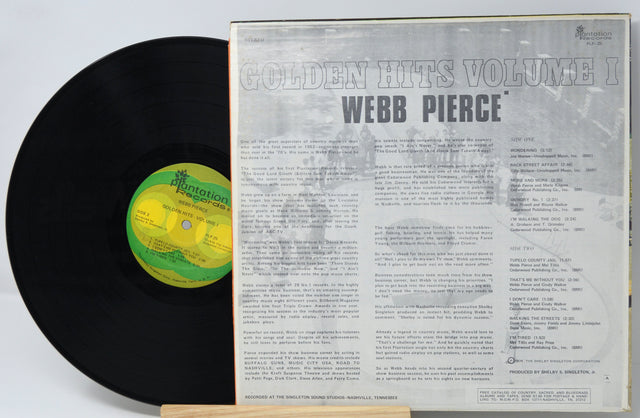 Back cover and vinyl record of Webb Pierce's Golden Hits Volume I with tracklist and liner notes