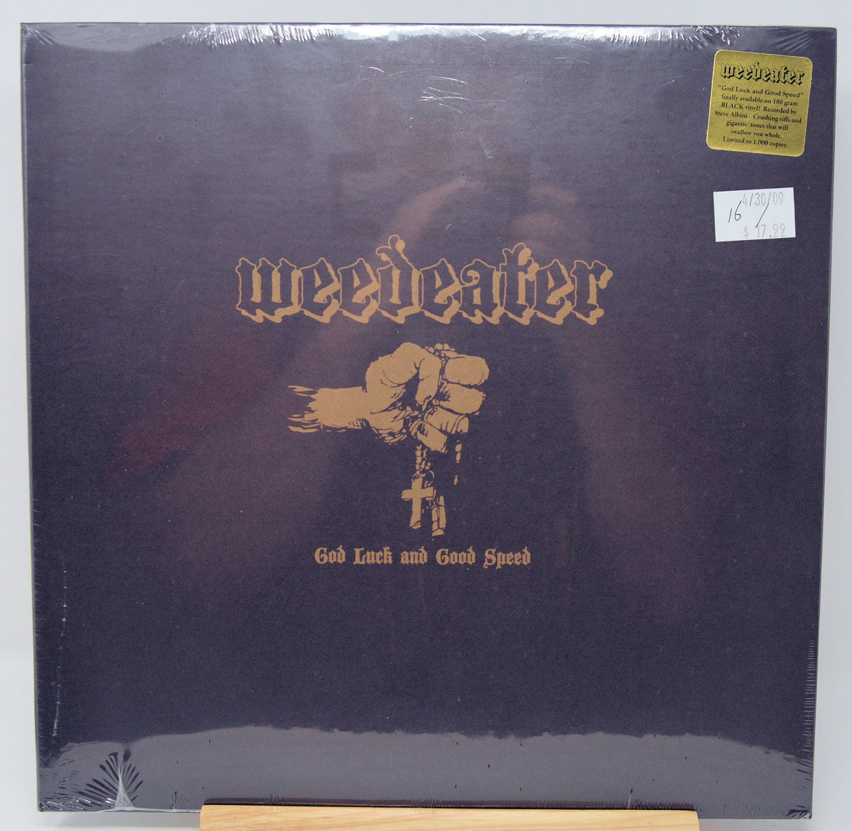 Front cover of Weedeater's 'God Luck and Good Speed' vinyl featuring fist and cross artwork