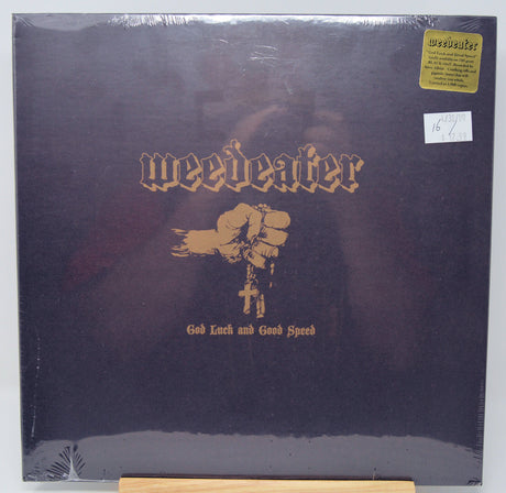 Front cover of Weedeater's 'God Luck and Good Speed' vinyl featuring fist and cross artwork