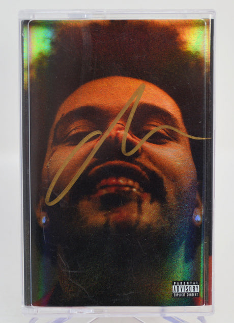 The Weeknd, After Hours Cassette tape with a colorful design featuring a face and a signature, on a white background. Autographed