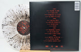 Vinyl record with sleeve showing tracklist on a white background