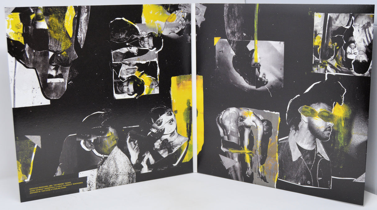 Artistic book or album with black, white, and yellow abstract designs on a white background