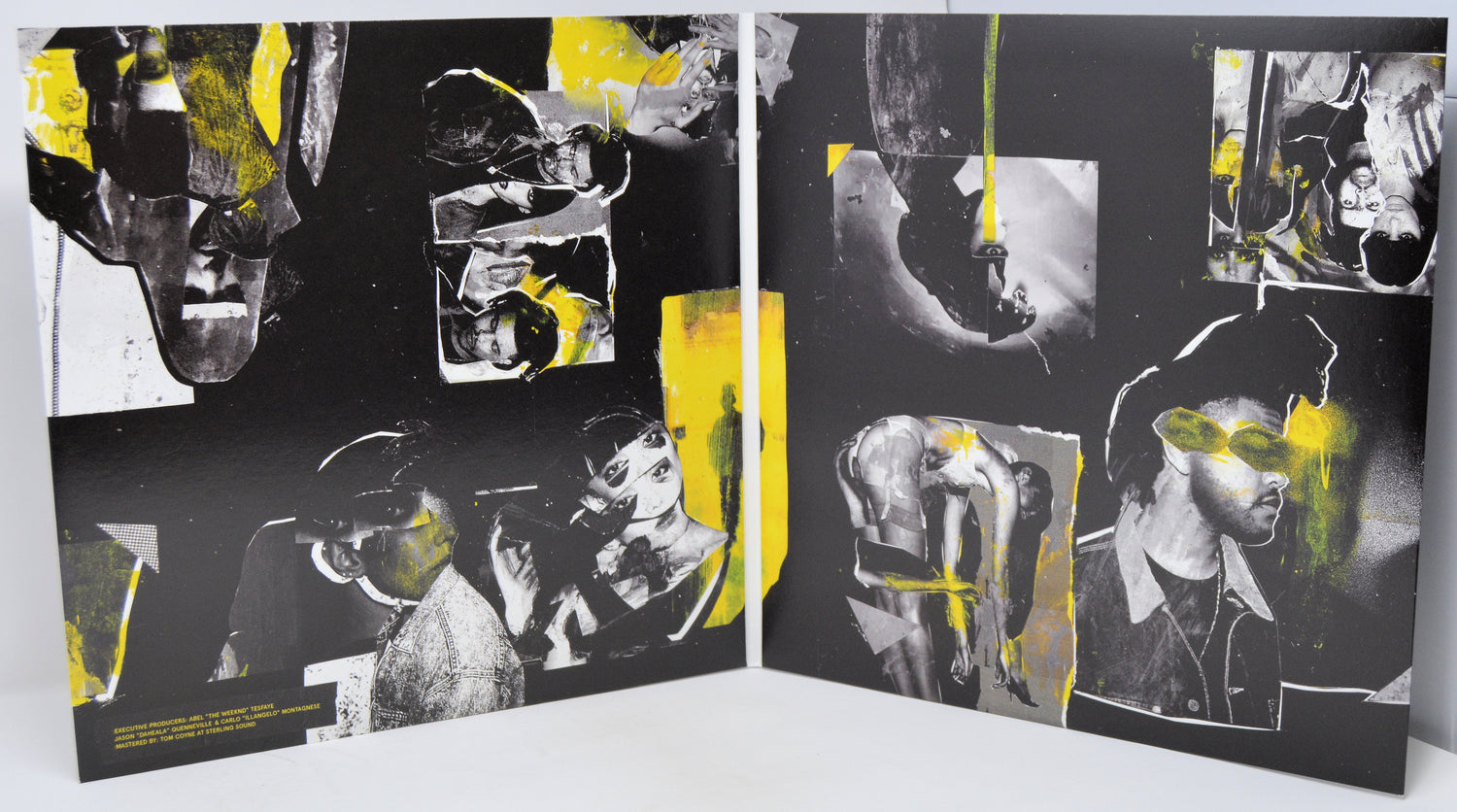 Artistic book or album with black, white, and yellow abstract designs on a white background