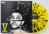 Vinyl record with a black and yellow design and a cover featuring a person's face.