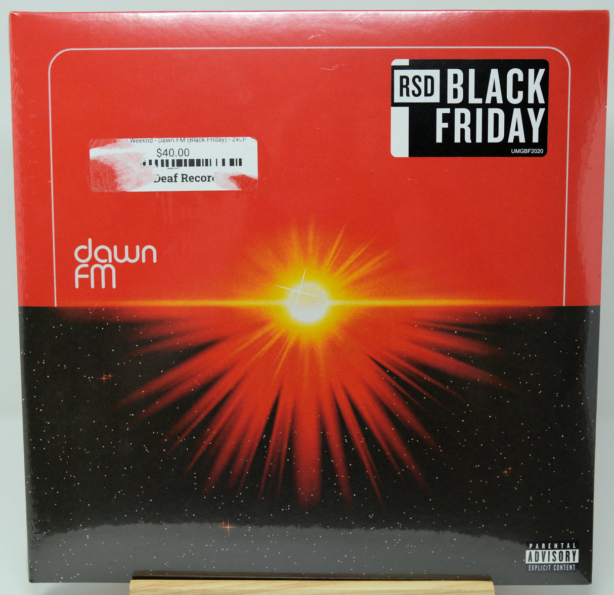 Vinyl record with a red and black design featuring a bright light and 'RSD Black Friday' branding.