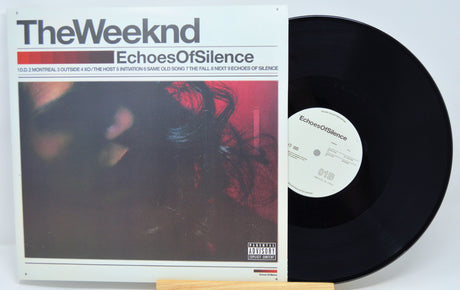 Vinyl record with 'The Weeknd' album cover titled 'Echoes of Silence' on a white background.