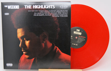 Vinyl record with black cover featuring a person and red disc on a white background
