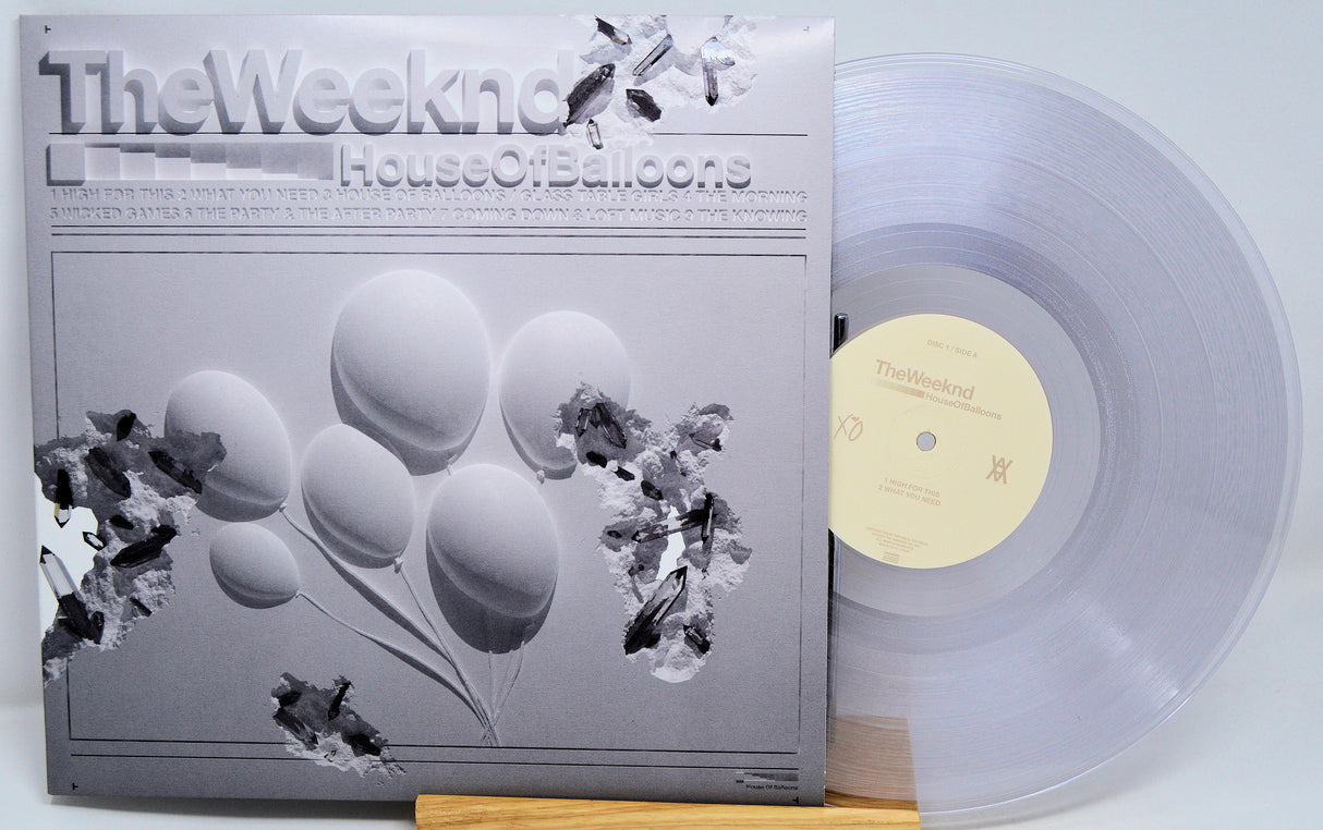 Vinyl record with a cover featuring balloons and text on a white background