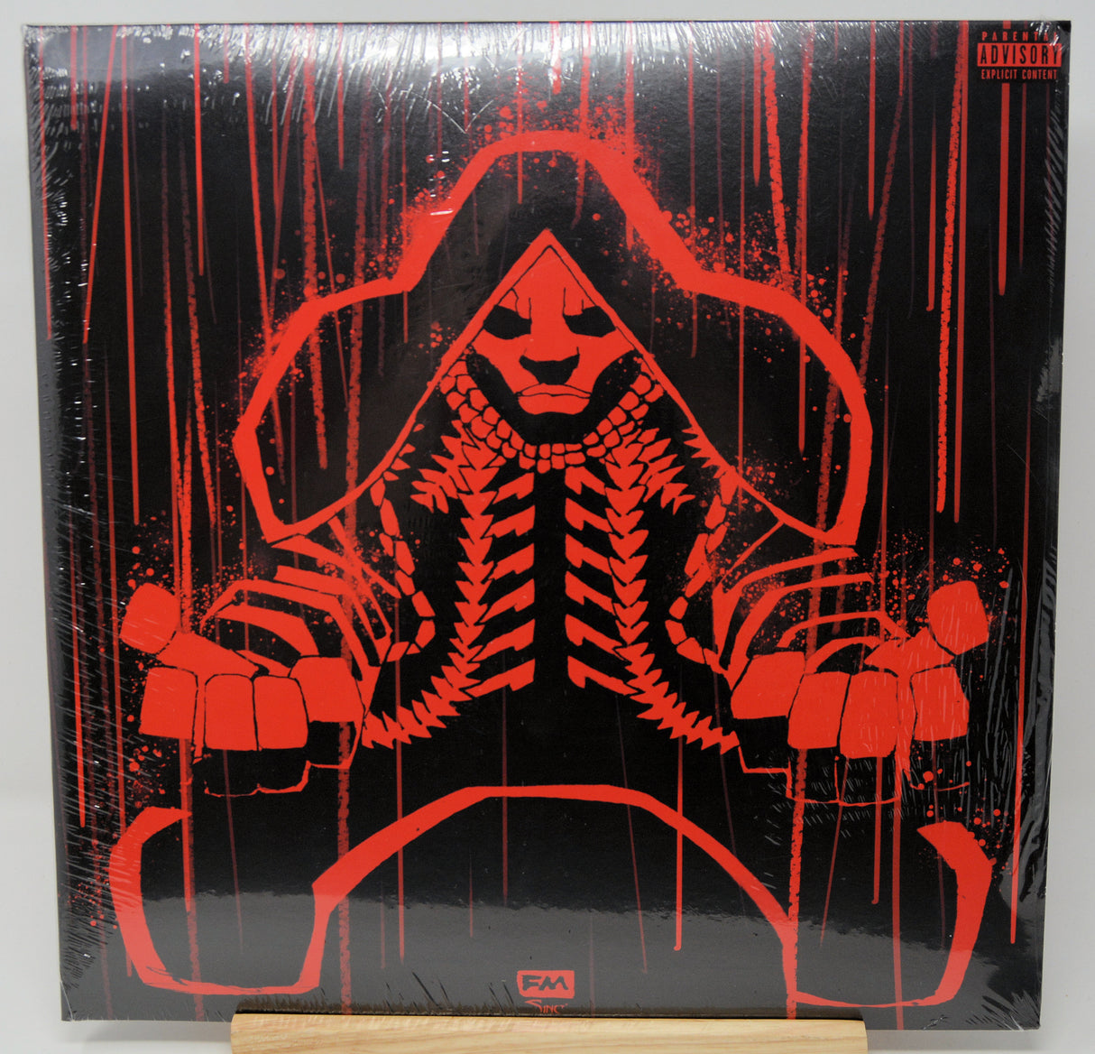 Vinyl record cover with red skeleton design on a black background