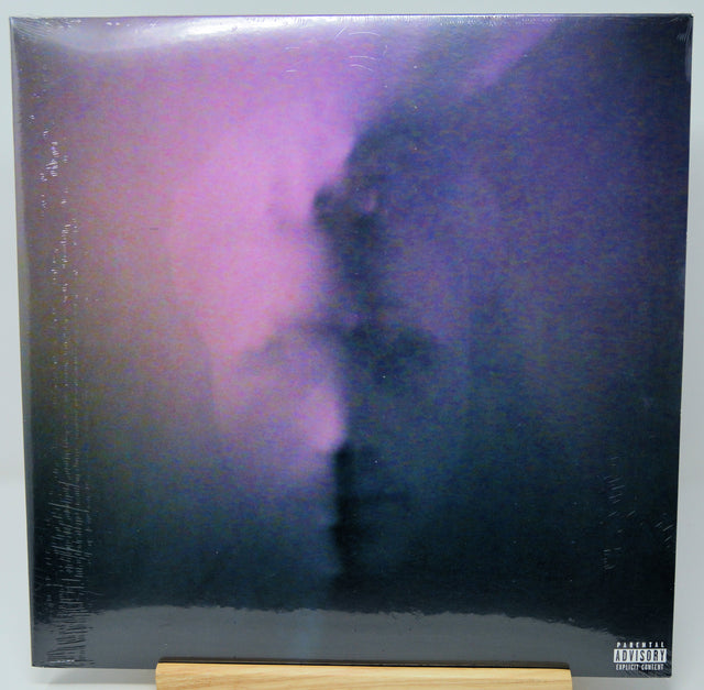 Vinyl record with a black and purple cover on a white background