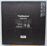 Back cover of a music album by The Weeknd with branding and release information.