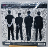 The back cover of the vinyl record 'Original Mystery Reptile' by the band EAGLE, featuring a black and white illustration of four men in suits from behind against a patterned background.