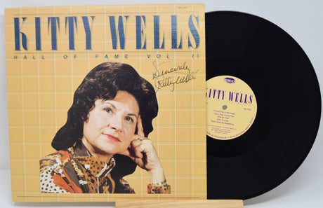 Vinyl record with cover featuring Kitty Wells' portrait and signature