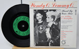 Vinyl record with a black cover featuring a couple and album details.