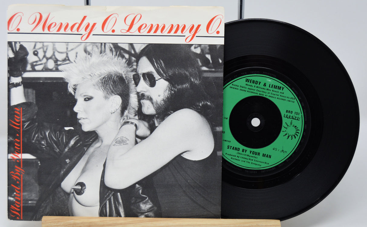 Vinyl record with cover featuring a black and white image of a person and red text.