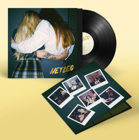 Promotional album cover featuring two individuals embracing, with the band name 'Wet Leg' displayed.