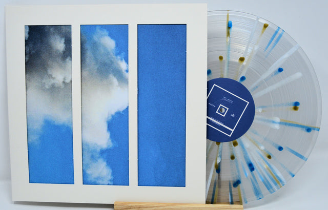 When No Birds Sang album cover with three-panel sky artwork and clear splatter vinyl record