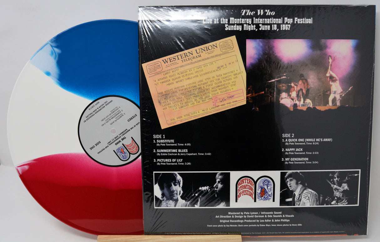 Vinyl record with a colorful disc and cover featuring concert images and text.