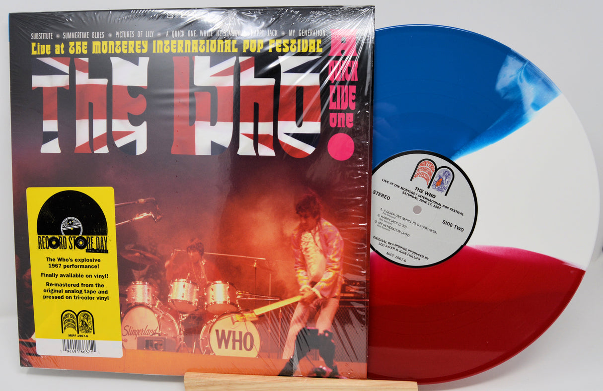 Vinyl record with a colorful label and 'The Who' album cover