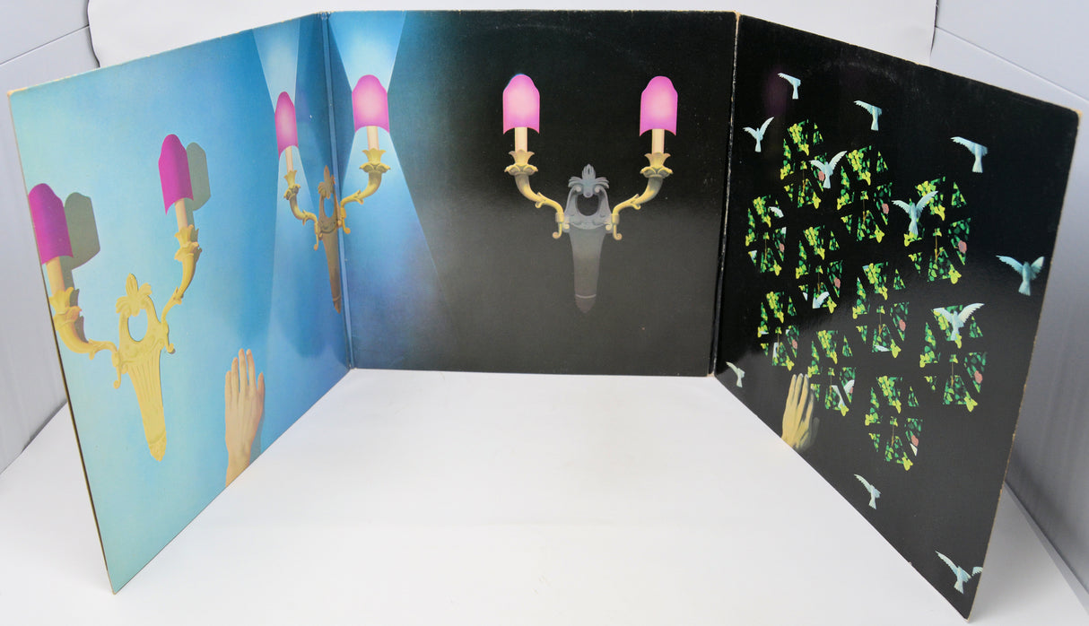 Fold-out card with chandelier design on a white surface