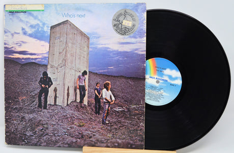 Vinyl record with cover showing a group of people in a desert landscape