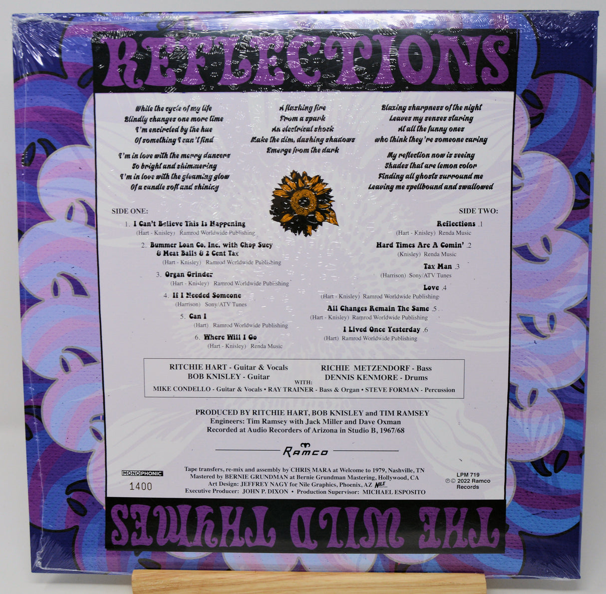 The back cover of the 'Surreal Action Show' compilation album 'Reflections' by Ramco Records, featuring purple and pink graphic designs, track listings, and artist credits.