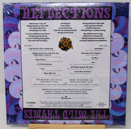 The back cover of the 'Surreal Action Show' compilation album 'Reflections' by Ramco Records, featuring purple and pink graphic designs, track listings, and artist credits.