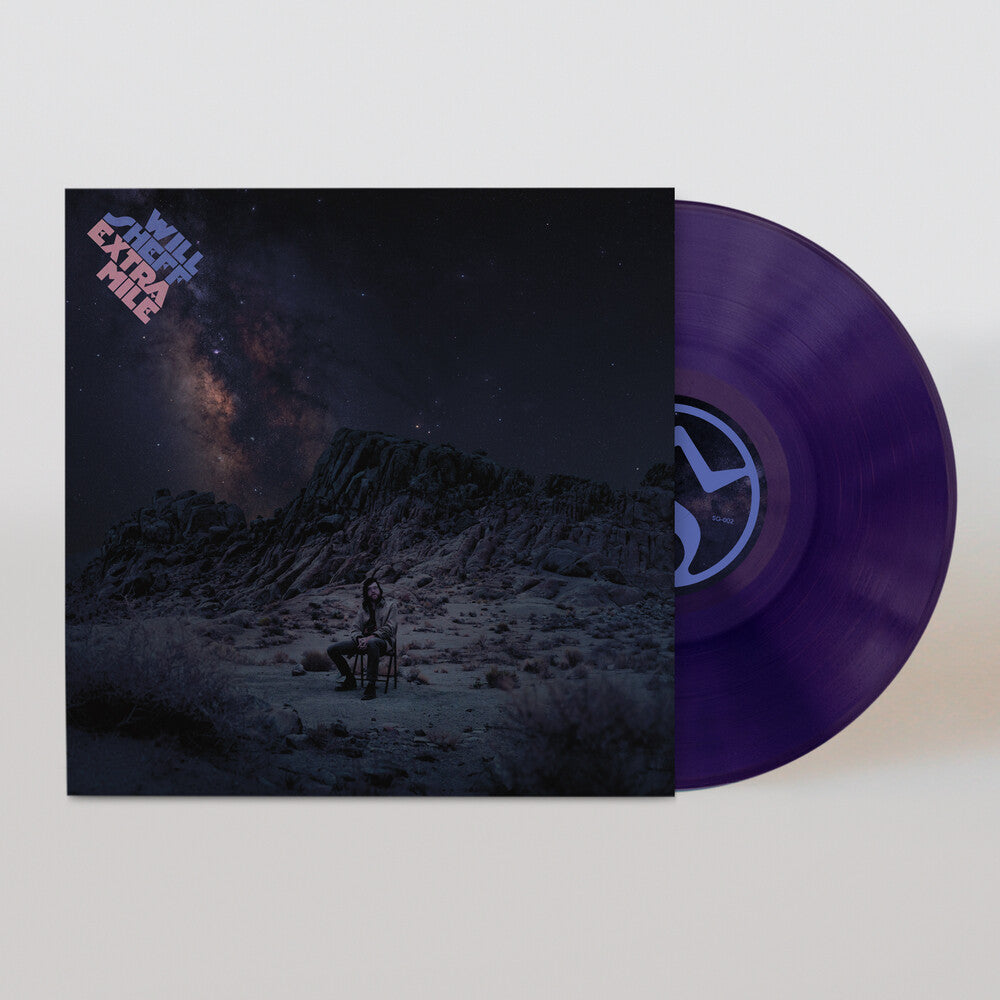 Vinyl record with a purple disc and cover featuring a mountain and starry sky design with Will Sheff sitting on a chair.