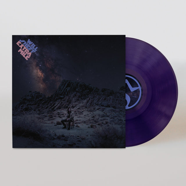 Vinyl record with a purple disc and cover featuring a mountain and starry sky design with Will Sheff sitting on a chair.