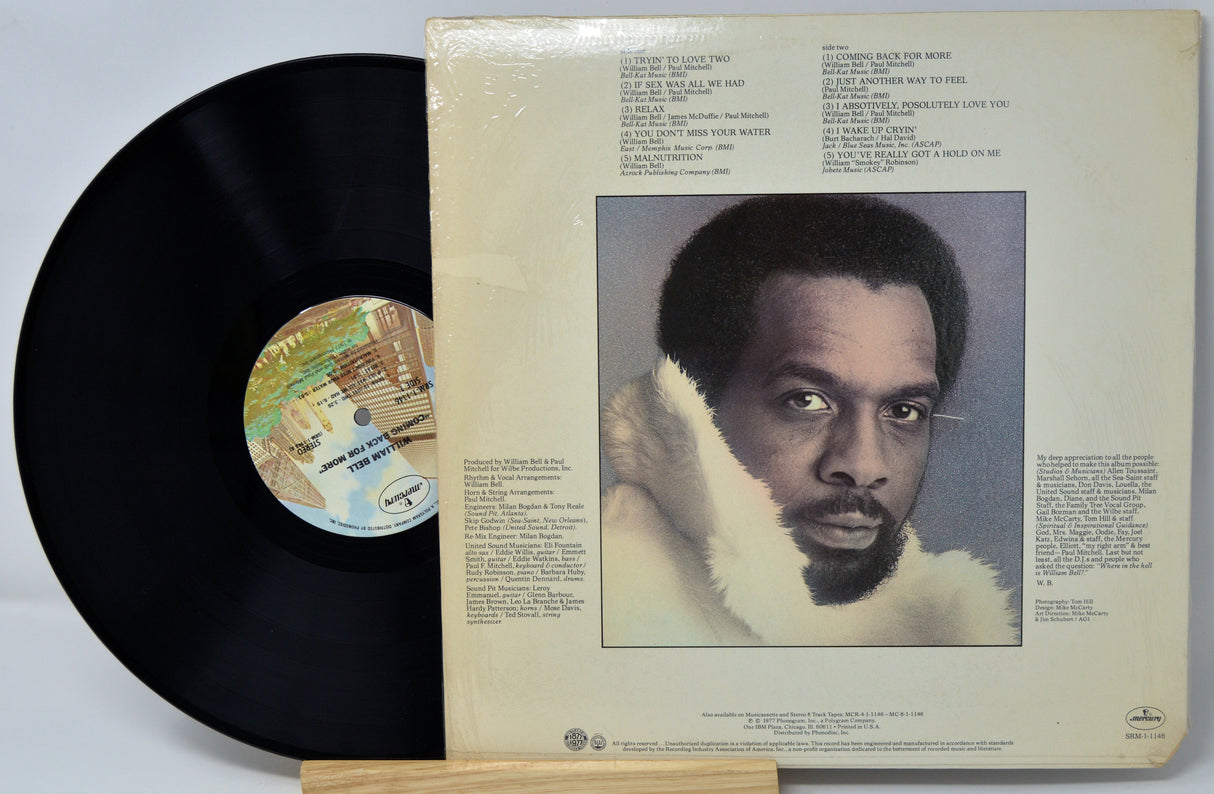 Vinyl record with cover featuring a portrait of a man and text