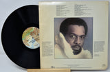 Vinyl record with cover featuring a portrait of a man and text