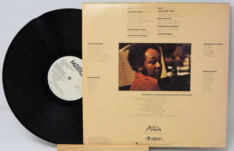 Back cover of William Eaton's Struggle Buggy vinyl LP featuring artist photo, song credits, and band information