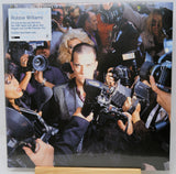 Vinyl record cover with a collage of a man surrounded by photographers and cameras.