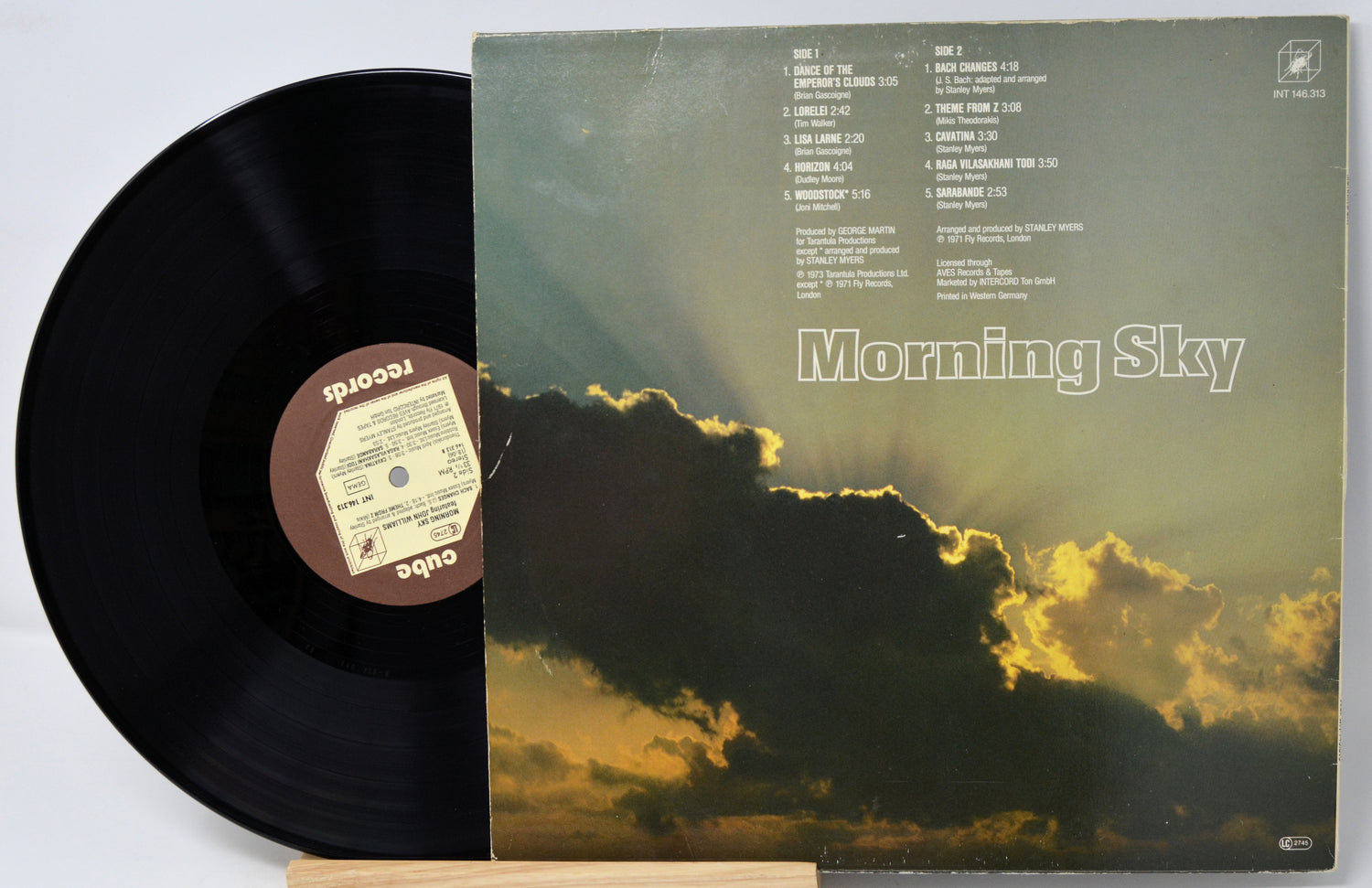 Vinyl record with 'Morning Sky' album cover featuring a cloud and sun design.