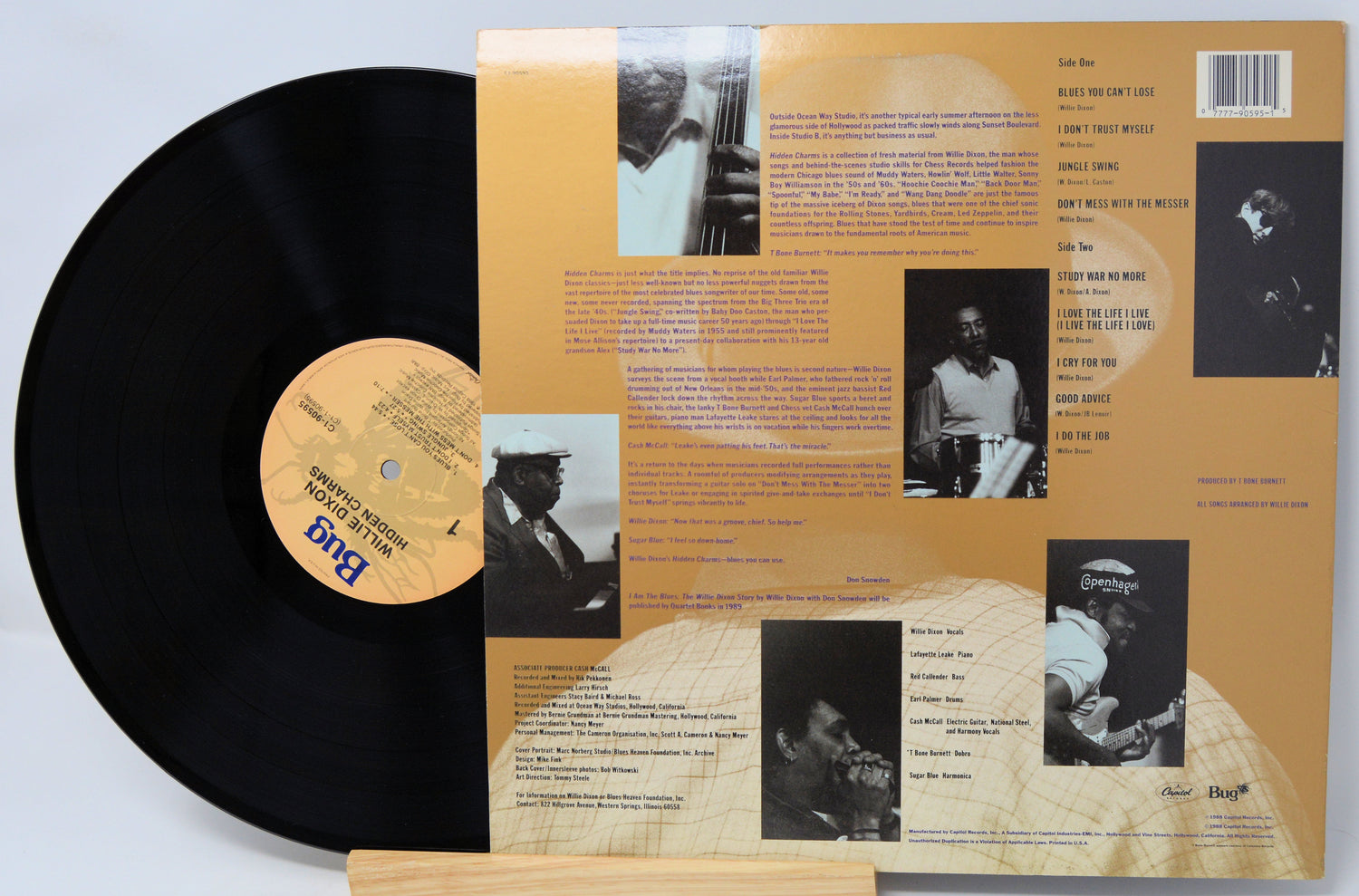 Vinyl record with a detailed album cover featuring black and white images and text.