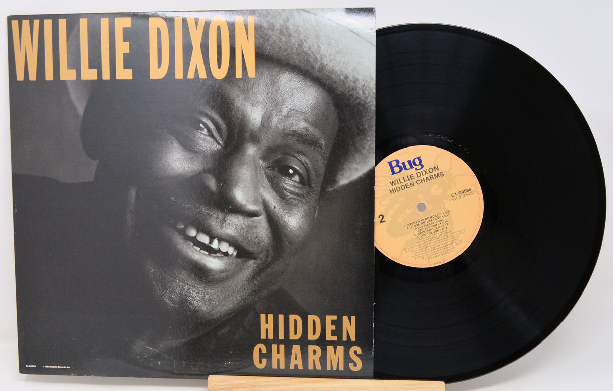Vinyl record with cover featuring Willie Dixon and 'Hidden Charms' text.