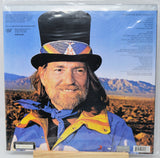 Vinyl record album cover for Willie Nelson's 'Starless', showing a portrait of Willie Nelson wearing a black top hat with colorful geometric bandwork and a blue-and-yellow jacket against a desert landscape background. Track listing and barcode are visible on the right side.