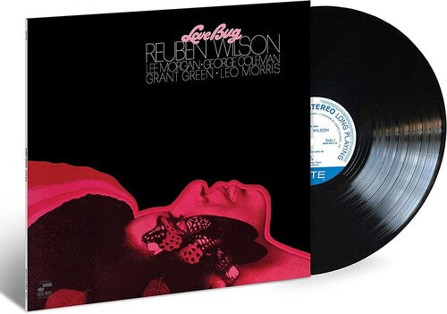 Limited edition vinyl LP cover for Wilson, Reuben - Love Bug featuring a stylized image of a woman with butterfly wings in a pink hue, with the artist and track name at the top.